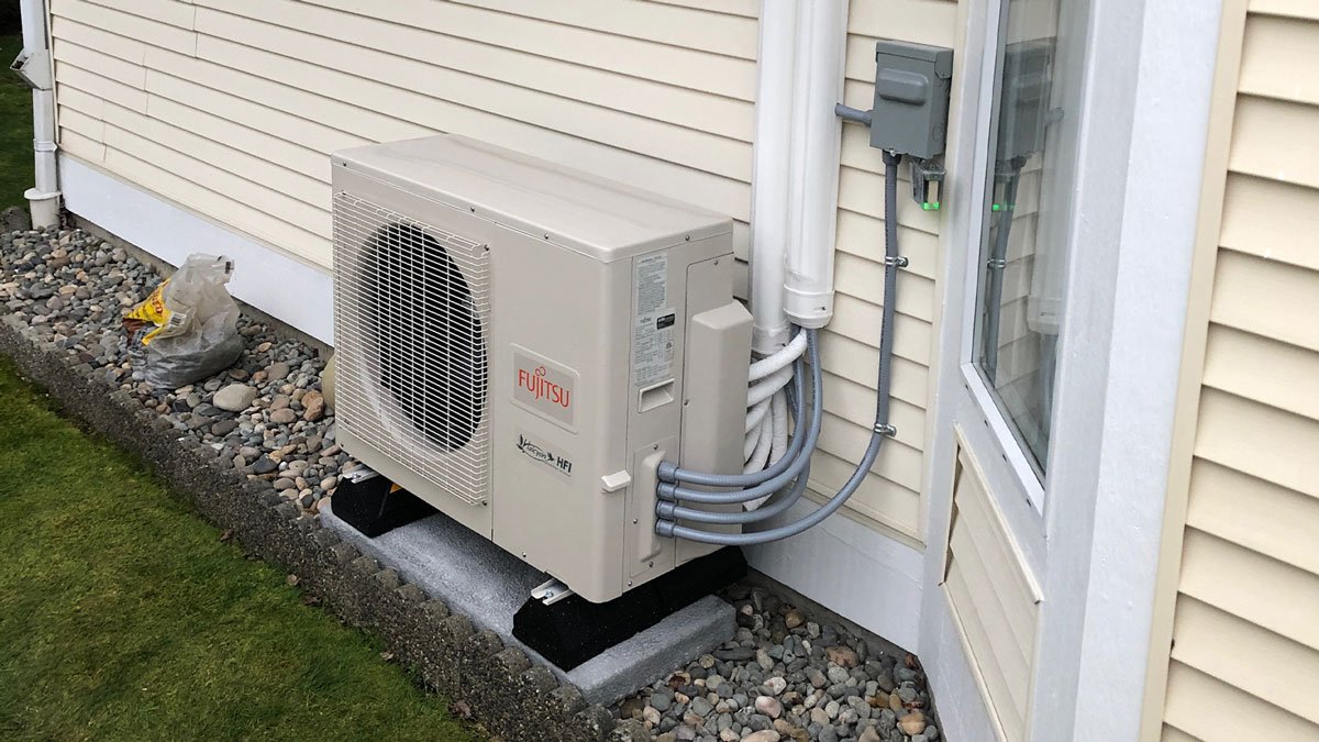 Ductless air conditioner mounted on outer wall - home depot mini split installation cost