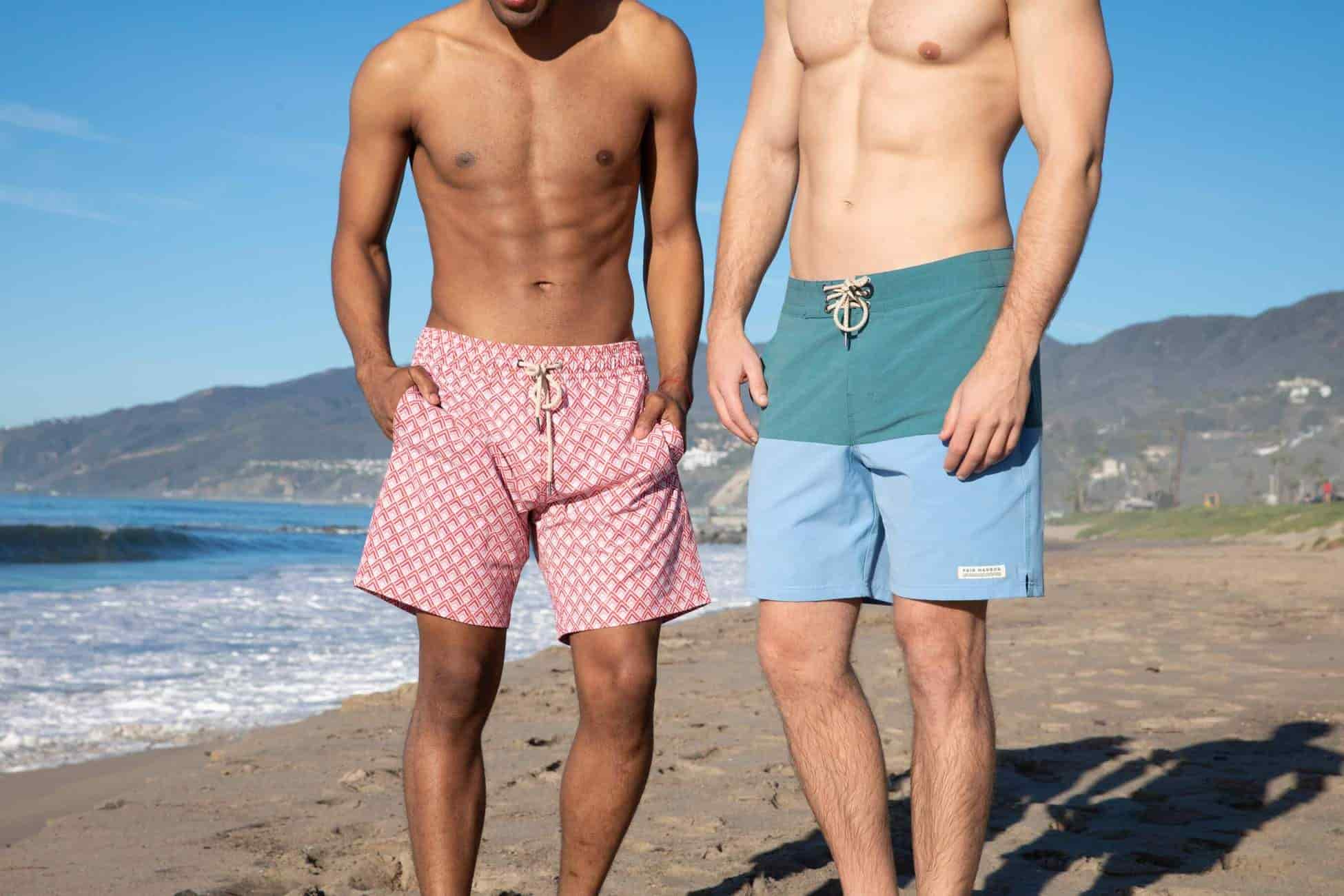 two men wear fair harbor swim trunks standing at beach - fair harbor swim trunks review - where to buy fair harbor swim trunks