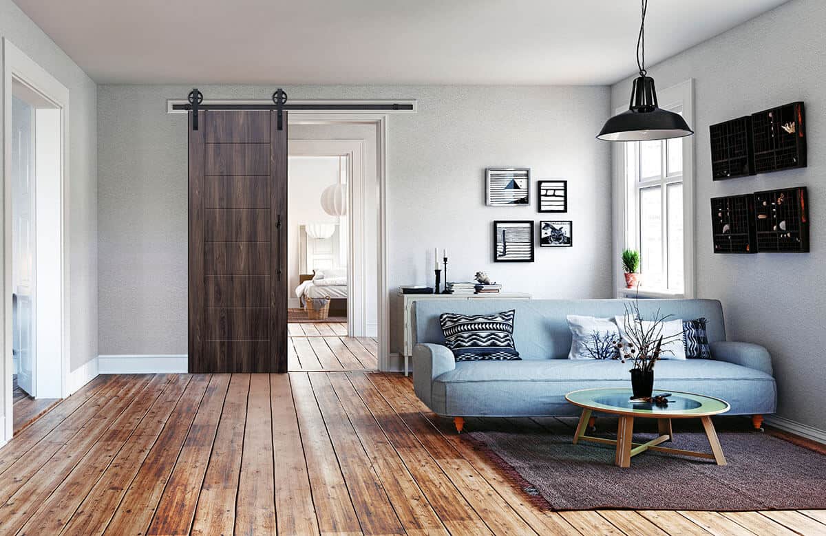 blue sofa on wooden floor with decorative pictures - urban modern interior design style - urban modern interior design ideas